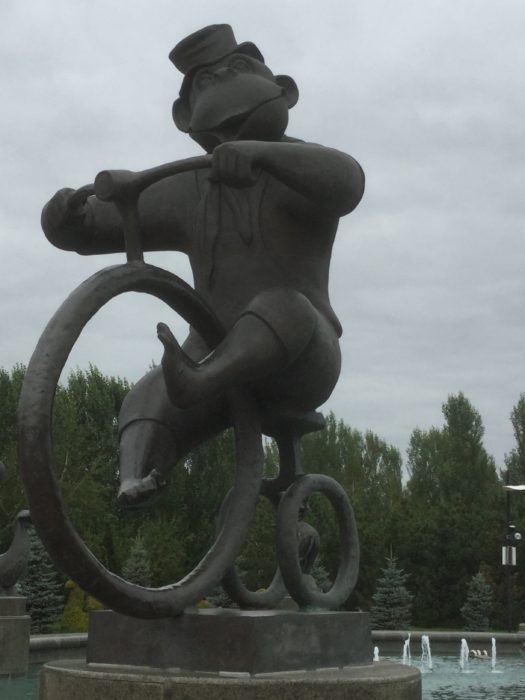 A monkey riding a bike, visit Astana