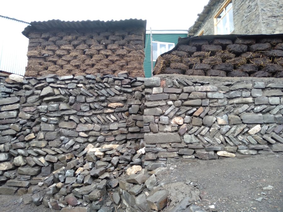 Stone walls, dung bricks
