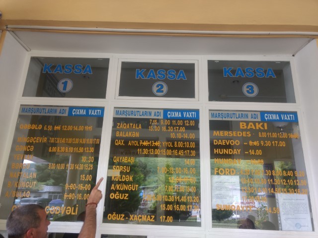 Bus timetable on window at Sheki bus station