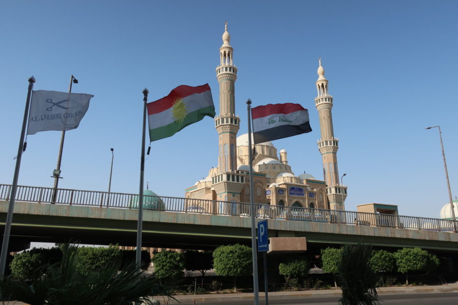 Flags framing Jalil Khayat mosque near Royal Mall in Erbil Iraqi Kurdistan