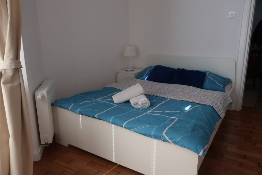 Double bed in apartment Krakow Poland