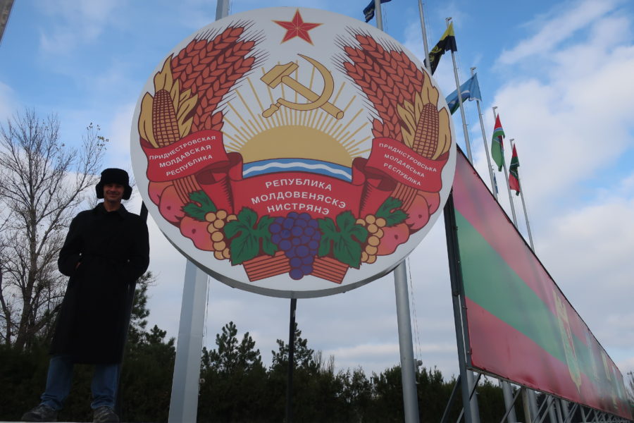 Lee and his new Belorussian hat in front of Pridnestrovskaia Moldavskaia Respublica sign Tiraspol Transnistria