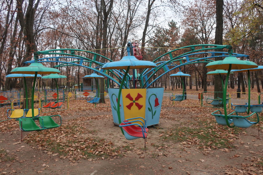 Fairground closed for winter in Park Pobeda or Victory Park in Tiraspol Transnistria